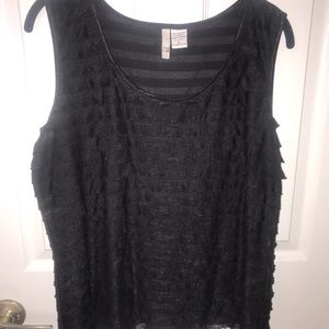 Ruffled black sleeveless top.